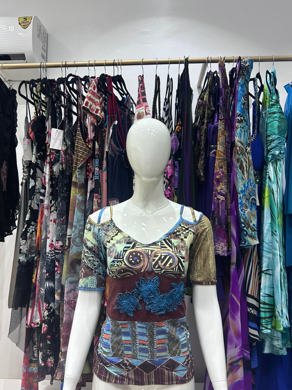 The Azure Mosaic Vintage Top – blue mixed print top with short sleeves