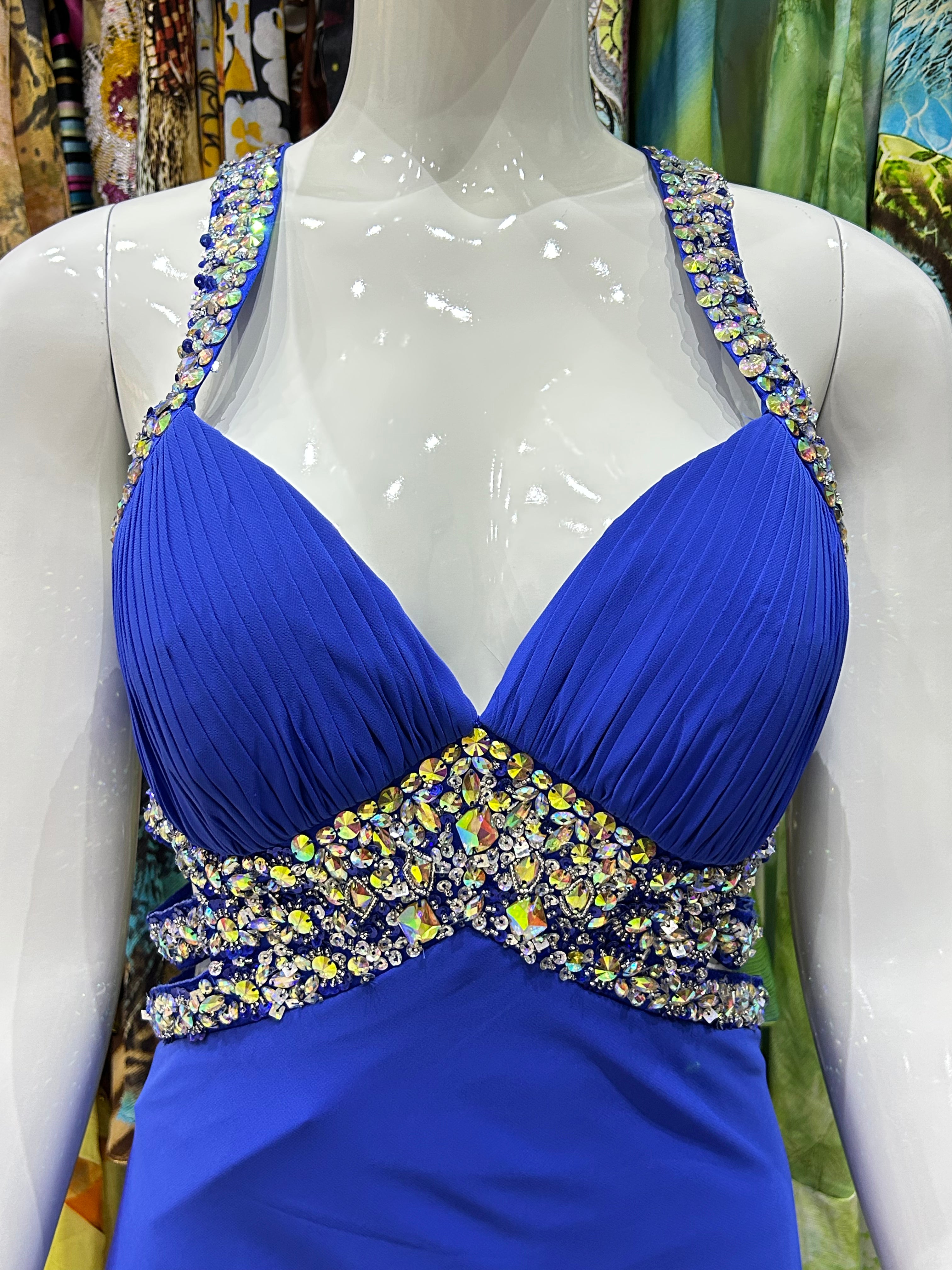 Blue dress with embellished neckline on a mannequin against a colorful background